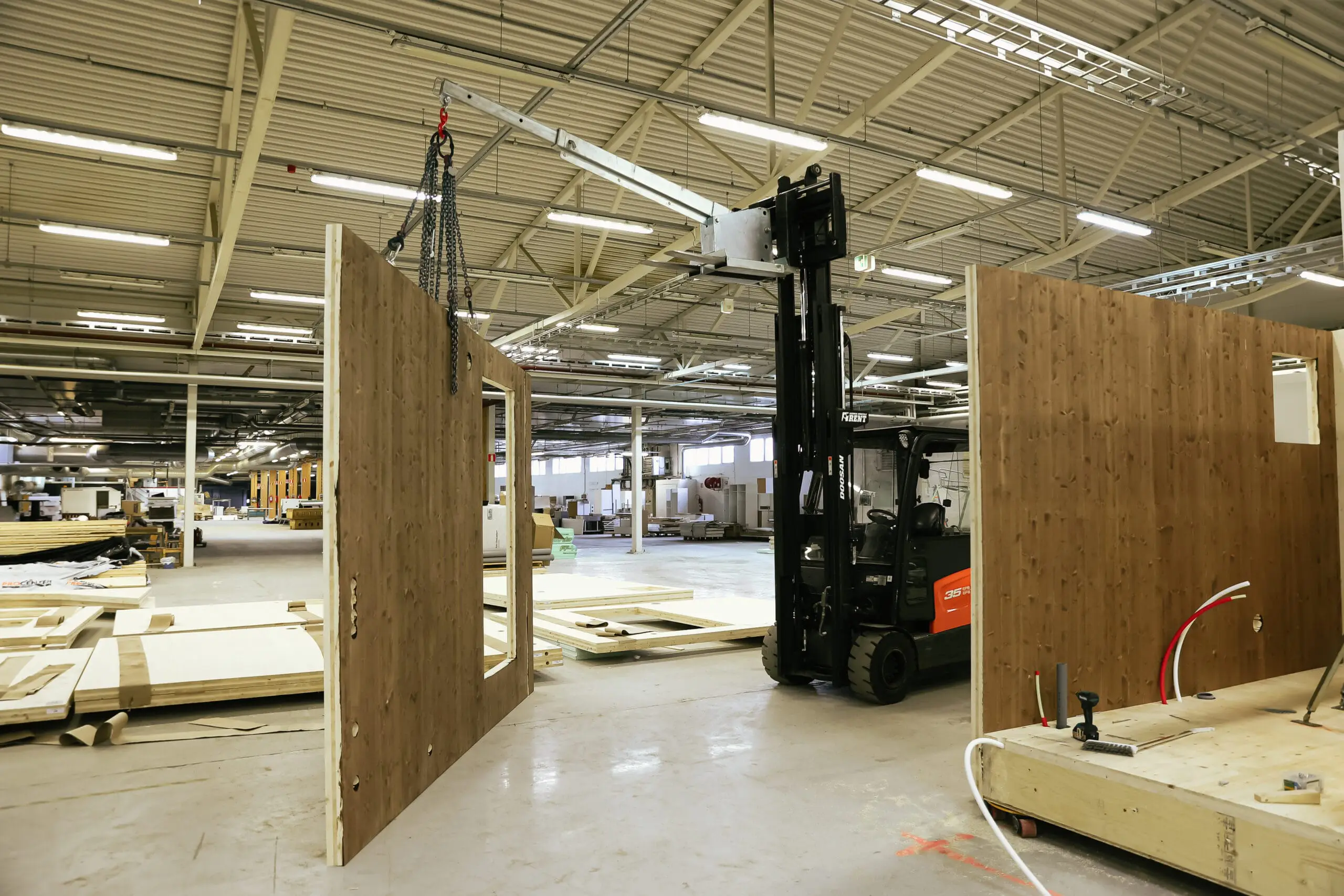 Modular timber elements and architecture of permanence construction at factory.