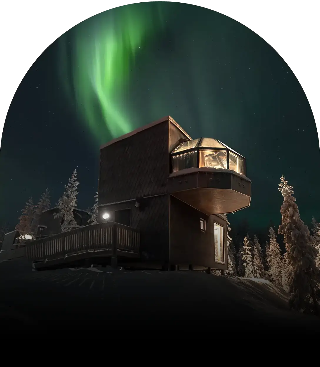 Luxury two-story glass igloo beneath glowing green Northern Lights.